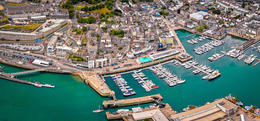 Aerial view of Plymouth Hoe and Royal Citadel along the waterfront in Plymouth, England, with cityscape and marina in the background
