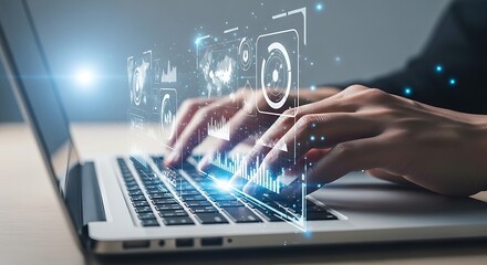 Hands typing on a laptop with futuristic glowing data visualizations overlayed