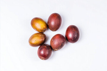 a group of fruit sitting on top of a white surface