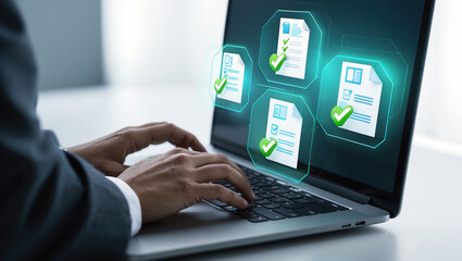 Businessman working on laptop with digital documents and approval checks