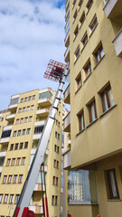 The job of lowering household goods from high floors with a lift crane and loading them onto the...