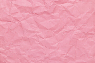 Fototapeta premium Delicate rose pink color abstract texture of crumpled paper, empty overlay background with wrinkles