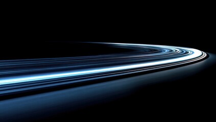 Abstract light trails form a curved path against a black background