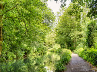 Leafy towpath beside the Cromford Canal, from Cromford Wharf to High Peak Junction. Cromford was the home of the industrial revolution in England.