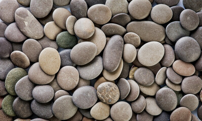 Black pebbles stone for background. Natural texture background. Design element.