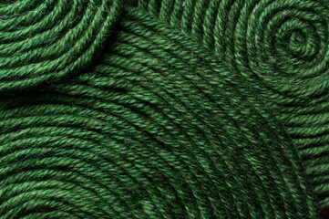 Obraz premium Green thread texture close-up, macro. Sewing thread banner, abstract background