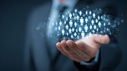 Businessman holding digital icons of people and team management, representing human resources, recruitment, employee data, business leadership, and digital HR solutions.