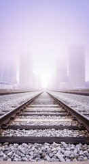 Fototapeta premium Railway disappearing into the horizon amidst urban fog cityscape scene