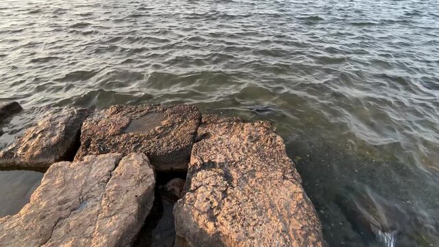Ancient Weathered Stones at the Edge of the Sea