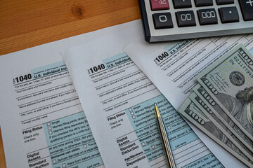 U.S. tax documents with currency and calculator for personal or business finance management