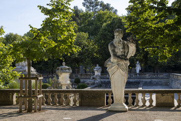 Obraz premium The Nymphaeum or Nymphée in the gardens of the Jardins de la Fontaine in the centre of the old Roman town of Nimes in the Gard region of France