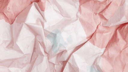 Crumpled paper with abstract pink and light blue paint splatters wrinkled texture