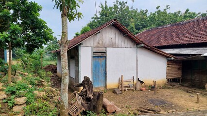 Sustainable Living in Southeast Asia: Rustic House & Cobblestone Path Amidst Nature (Architecture: Vernacular, Environment: Tropical Ecosystem) © Nyutikno