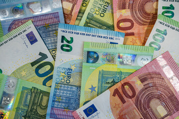 Mixed Euro banknotes background in various values representing cash flow, banking and savings