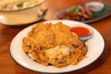Minced pork omelet on stream rice with chili sauce. Thai call khao kai jeaw moo sab