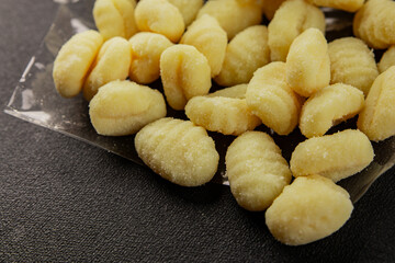 Gnocchi raw potato dough snack fresh delicious gourmet food background on the table  rustic food top view copy space vegetarian food