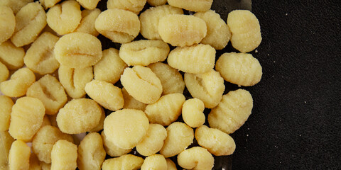Gnocchi raw potato dough snack fresh delicious gourmet food background on the table  rustic food top view copy space vegetarian food