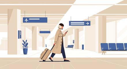 Stylish woman with suitcase and mobile phone in modern airport terminal design