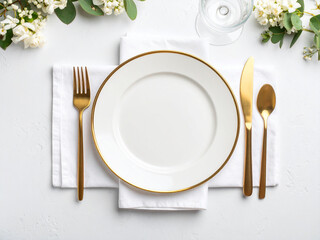 Top-Down View of Elegant White Porcelain Dinner Plate with Gold Rim and Silver Cutlery on White Linen Tablecloth