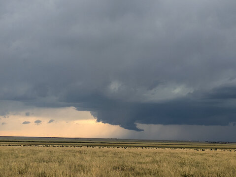 Wall cloud hangs off a tornado-warned thunderstorm.