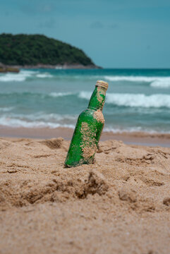 Bottle Of Water On The Beach And White Sand