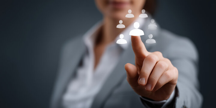 Businesswoman Pointing at User Icons in a Digital Network Environment for Social Media and Technology Development Concepts