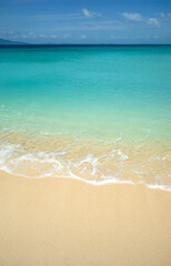 Vertical view of a paradisiacal beach on Bamboo Island with its clear sandy waters, in Krabi province, Thailand