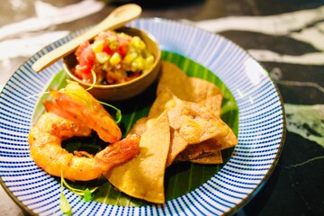 Shrimp appetizer with guacamole and crispy chips