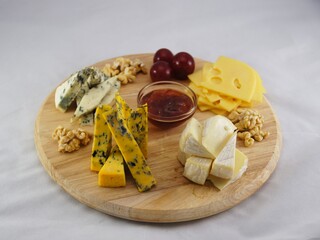 Charcuterie board with different types of cheese