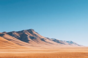 Naklejka premium Vast desert landscape under clear blue sky, showcasing majestic