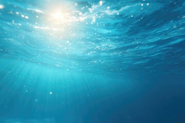 Bright sunlight filters through tranquil ocean waters, creating