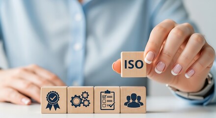 Photo of person holding iso quality standard block with other quality icons