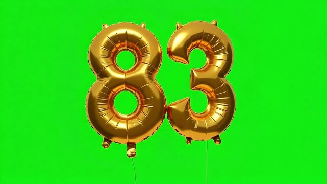 Golden number 83 balloons float celebrating milestone achievement or anniversary with shimmering detail