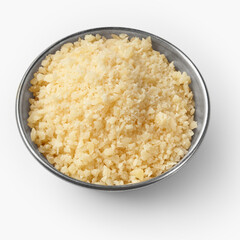 Grated parmesan cheese in a small metal bowl on white background