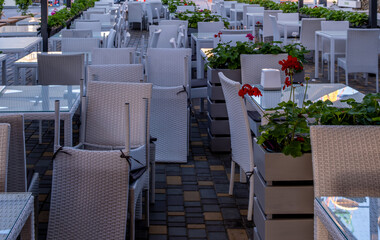 Tables and chairs on the veranda of the summer cafe.