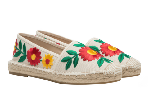 White espadrille shoes with colorful floral embroidery isolated on transparent background