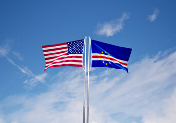 flags of  Cabo Verde and United States of America over blue sky background.