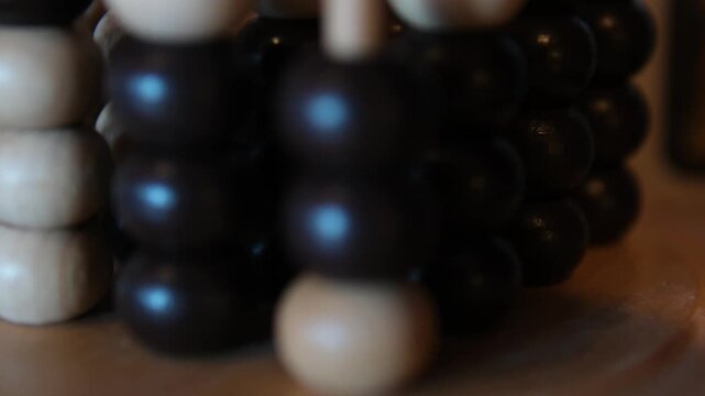 Old wooden abacus on wooden surface close up