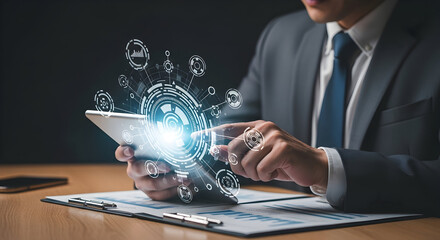 Modern professional uses a tablet to access and analyze complex digital data visualizations.