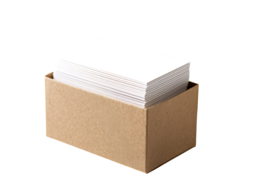 A cardboard box filled with stacks of blank white paper.