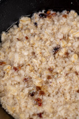 old banana on a black pine wood table close up, an old rotting ripe banana whose color changes from yellow to black
