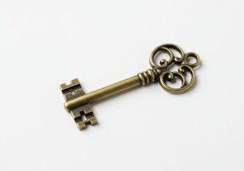 An antique golden key to success is isolated on a wooden background, representing security and the unlock to a safe home