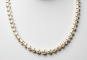 Fototapeta premium Elegant pearl necklace displayed on white background for fashion and jewelry use