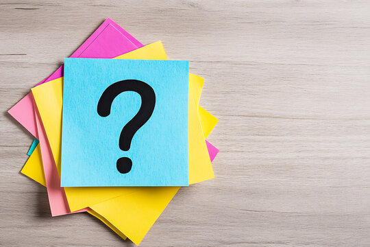 Question mark on colorful sticky notes, symbolizing curiosity, uncertainty, problem-solving, and brainstorming. Idea generation and decision-making.