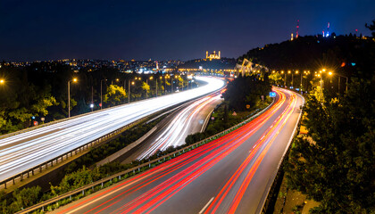 Fototapeta premium Nighttime traffic and the cityscape create a beautiful symphony of lights