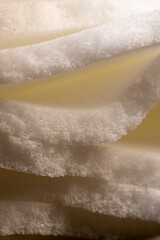 foam for storing close up, white foam porous structure is old and dirty after use and long-term operation