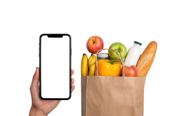 Smartphone and grocery bag with fresh food. Online ordering and delivery concept.