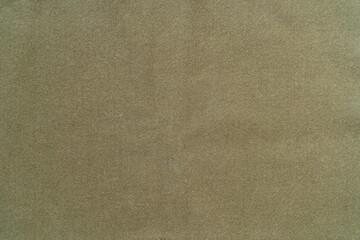 Beige cotton fabric.A photo of the texture of a green protective fabric.