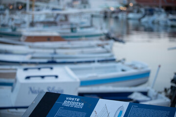 The seaport in Betina, Murter island, Croatia at dusk. Cold tone harbour background. Fishing boats