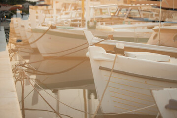 Aesthetic seaport background. Harbour with fishing boats. Double exposure of the ocean and sunset. Abstract design